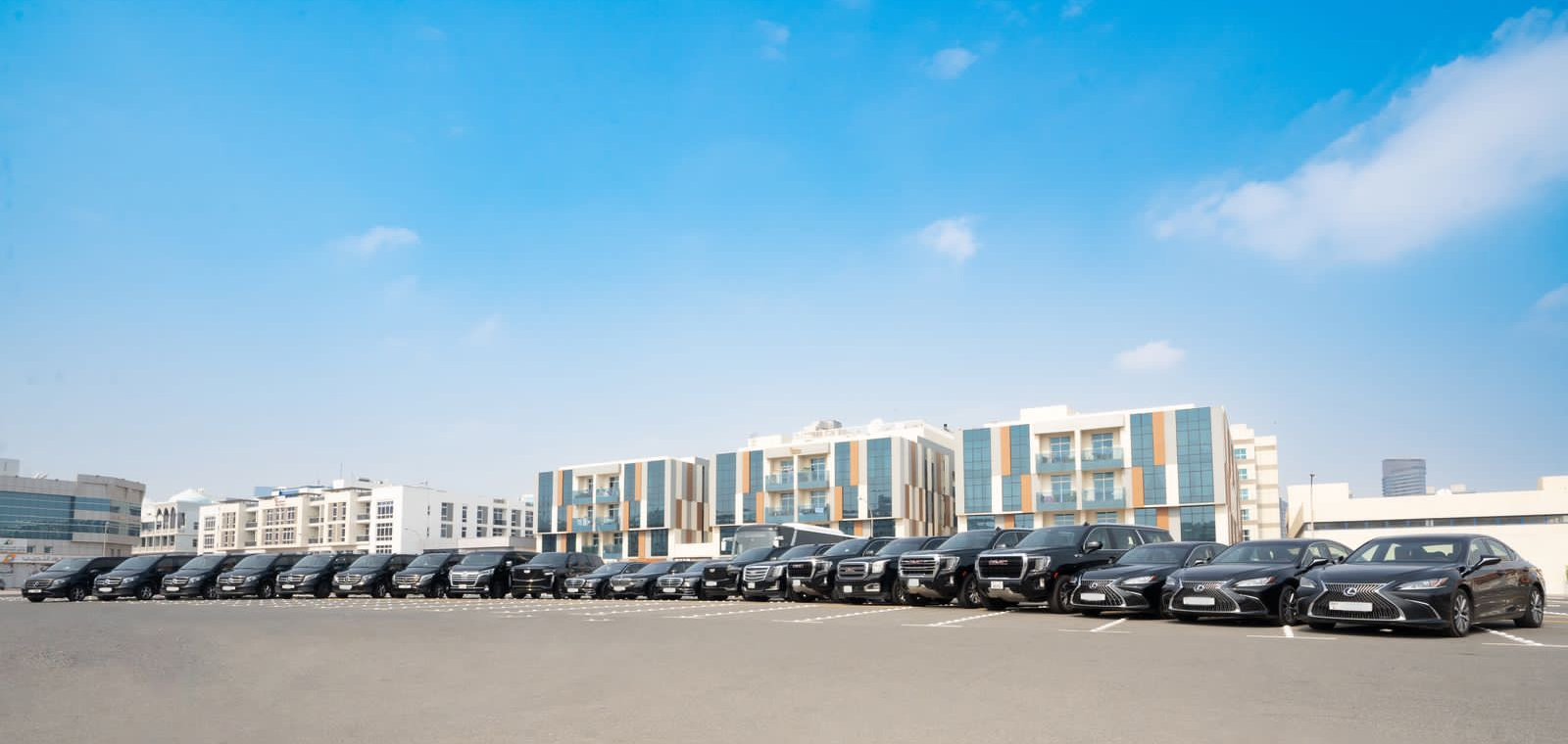 Professional chauffeur with a premium black limousine in Dubai